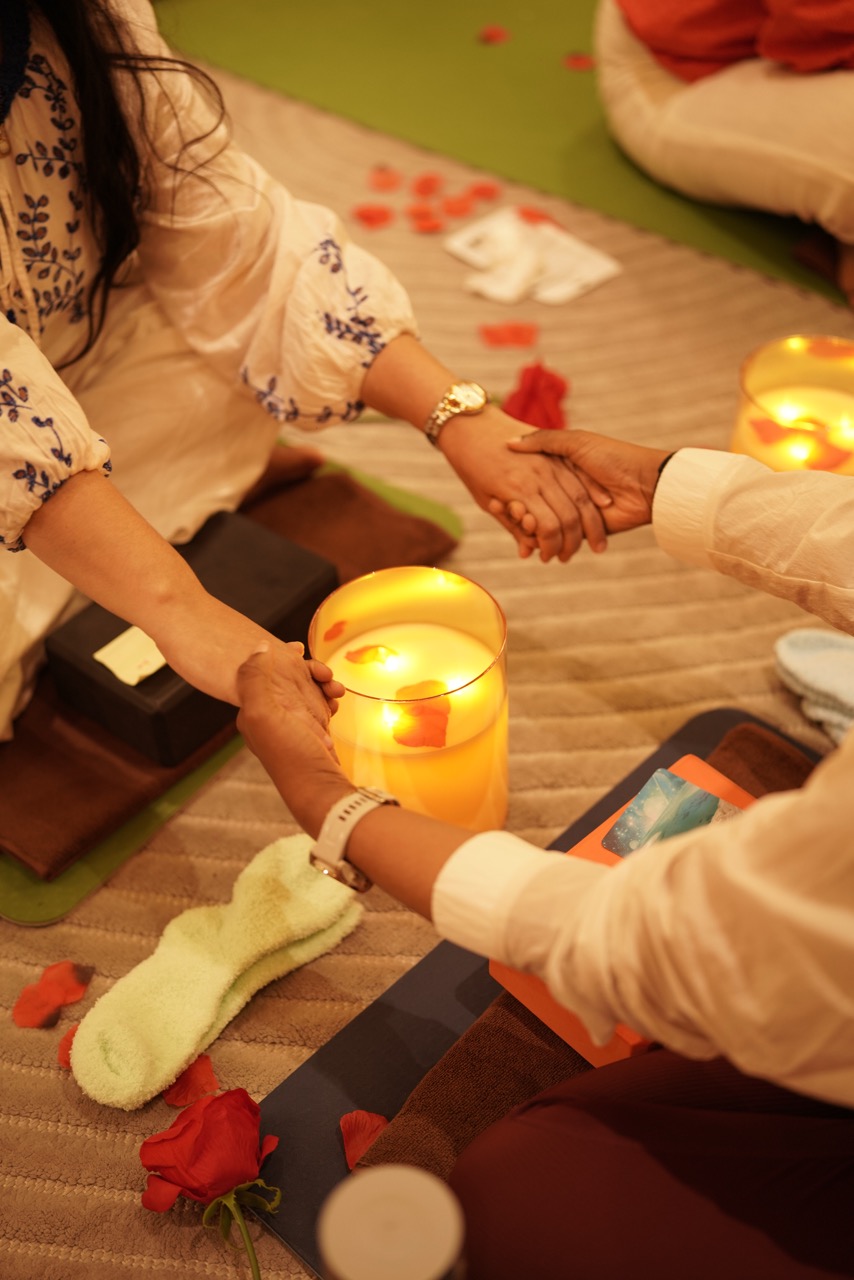 Candle and holding hands